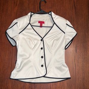 Very flattering women’s top! Size 10. Cream color with black detail.